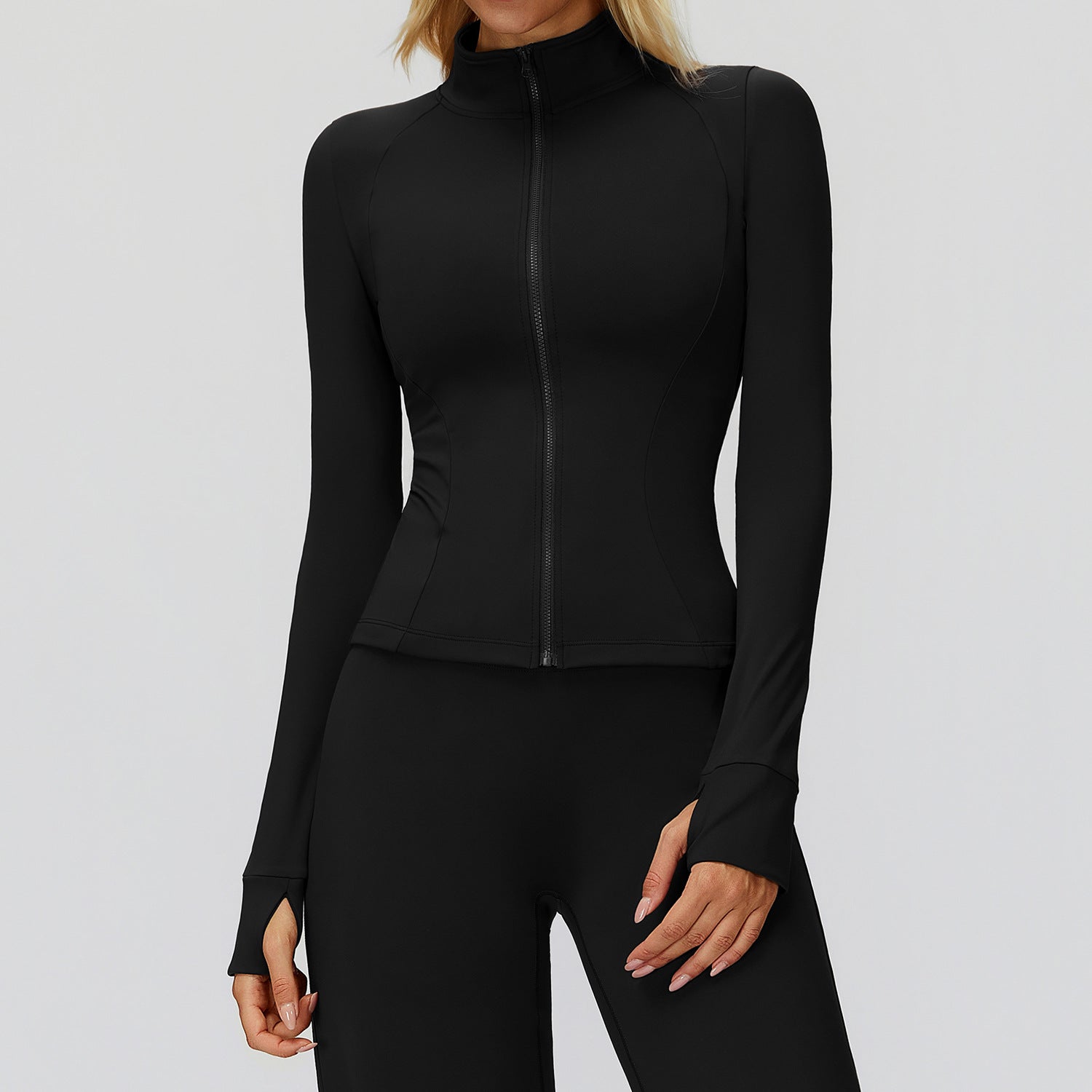 Black full-zip golf jacket with a stand collar zipped to the neck, front view showing the thumbhole cuffs