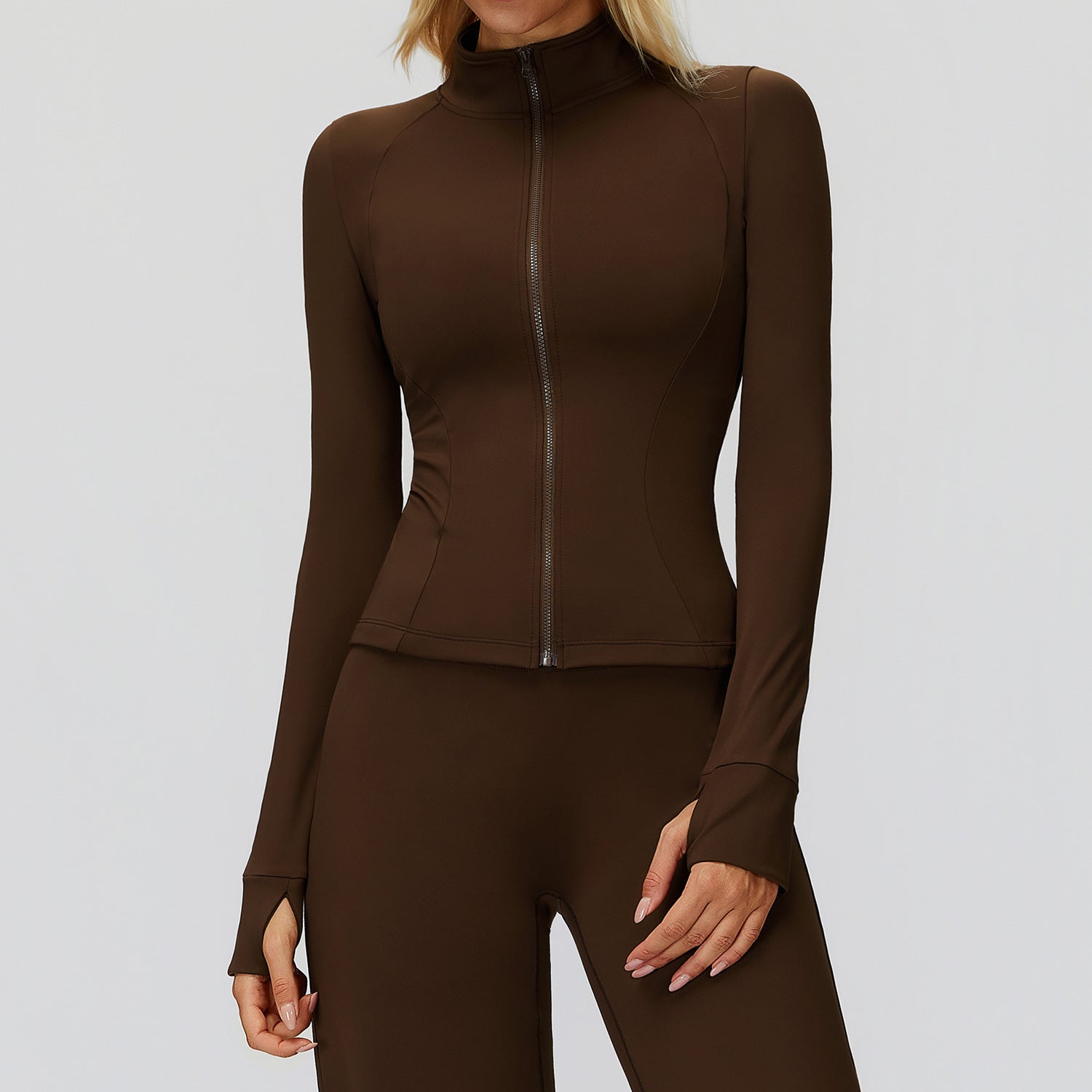 Brown full-zip golf jacket with a stand collar, front view with arms at the sides showing thumbholes