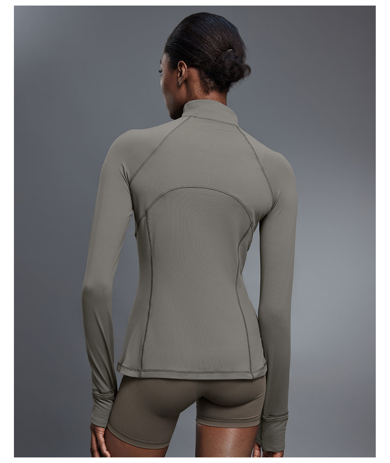 Back view of olive quarter-zip golf pullover with matching shorts, showing the curved back yoke seam