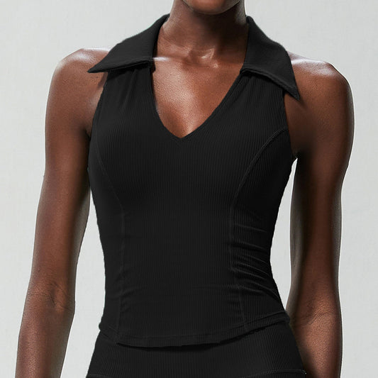 Model wearing the black ribbed sleeveless golf top, front view showing the collared V-neck