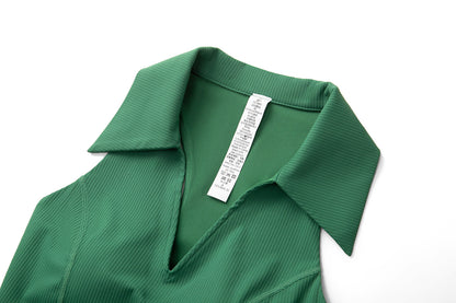 Close-up of the collared V-neck and inside neck label on the green ribbed sleeveless golf top