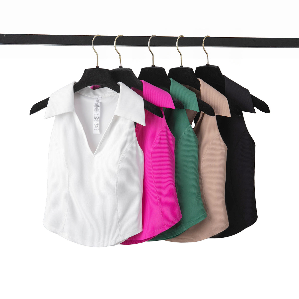 wilma ribbed sleeveless golf top in white, fuchsia, green, beige and black, hanging side by side on hangers